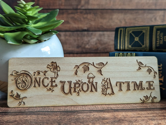 A wooden bookmark that says "once upon a time."