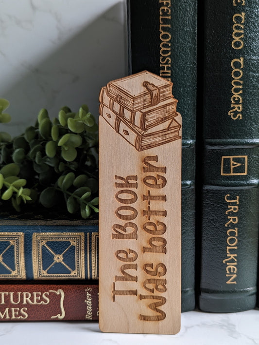 A wooden bookmark that says "the book was better."