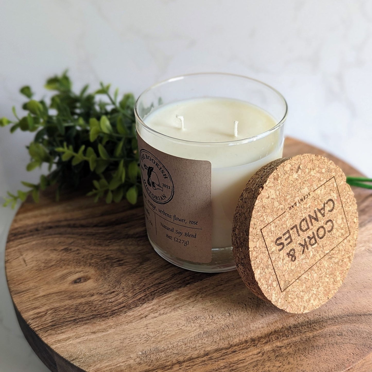 Lemon verbena candle with the TBH logo.