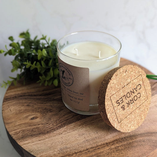 Lemon verbena candle with the TBH logo.