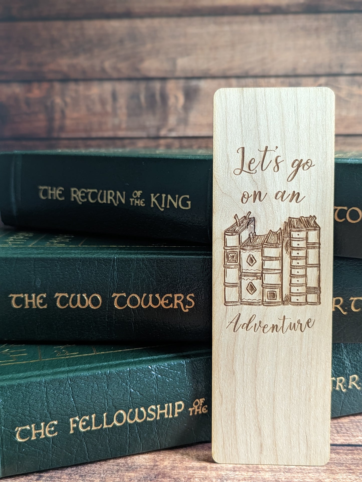 A wooden bookmark that says "let's go on an adventure."