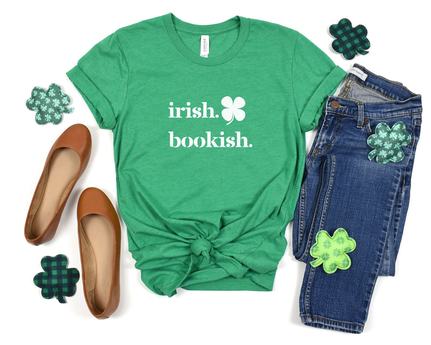 White "Irish & Bookish" design on a kelly green t-shirt surrounded by St. Patrick's Day-themed accessories.