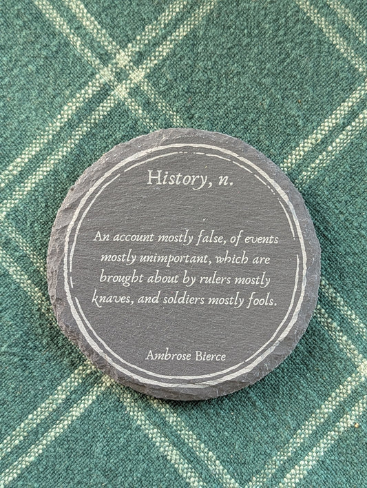 Slate coaster with a laser-engraved design of a definition of history by Ambrose Bierce.